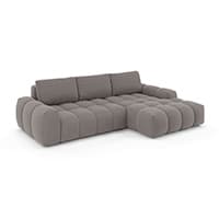 Graues Sofa mit breiten, gepolsterten Sitzflächen und einer Ottomane auf der rechten Seite