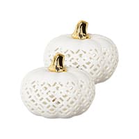 Zwei weiße Keramik-Kürbisse mit goldenen Stielen, durchbrochenes Muster auf der Oberfläche.